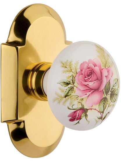 Arched Rosette Door Set with Rose Porcelain Knobs in Polished Brass.